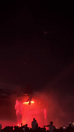 Live band performs under green lights in La Quinta concert