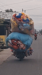 Stuffed animals and street life in Lhokseumawe's morning market zone
