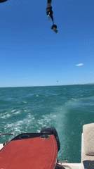 Boat travels turquoise waters off Spanish coast near Benalmádena