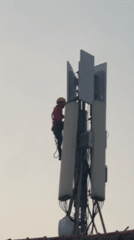 Telecom worker maintains cell tower in North Jakarta