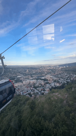 Cable car ride captures Tbilisi landmarks on clear day