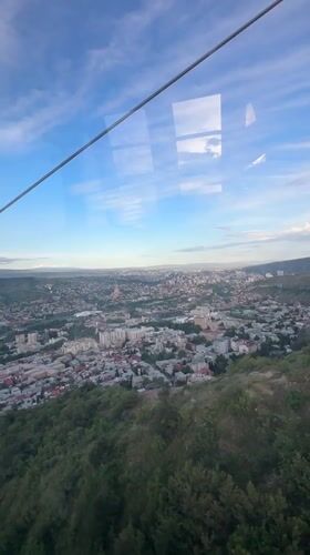 Cable car ride captures Tbilisi landmarks on clear day