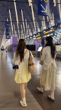Strolling through Pudong Airport's terminal concourse