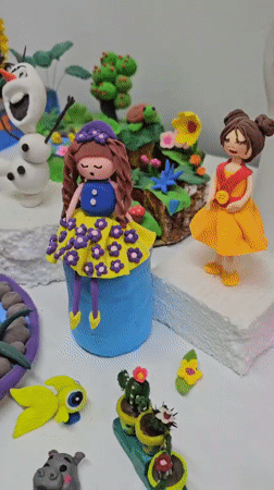 Handmade clay figurines and tiny dioramas up close