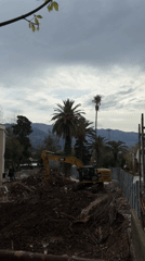 Excavator clears construction debris in coastal Budva, Montenegro