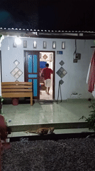 Woman takes selfies at home in Baron, Indonesia