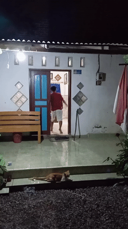 Woman takes selfies at home in Baron, Indonesia