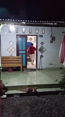 Woman takes selfies at home in Baron, Indonesia