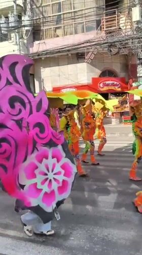 Traditional costume parade winds through Dumaguete streets Friday morning