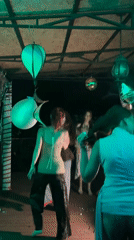 Late-night outdoor party under green lights in southern Russia