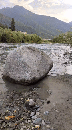 Afternoon at the Adda River, Sondrio, stone heart on the shore
