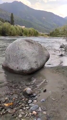 Afternoon at the Adda River, Sondrio, stone heart on the shore