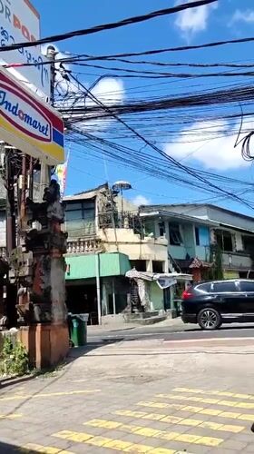 Street pause near an Indomaret in sunny Denpasar