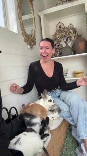 Two women visit rabbit enclosure in Solana Beach