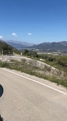 Motorcycle rider travels scenic Montenegro roads near Kubasi