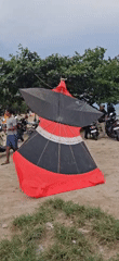 Traditional Balinese kites fly over Denpasar beach morning