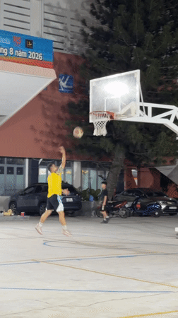 Youth basketball practice night at a Nha Trang outdoor court