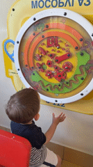 Child plays with interactive toys in Odintsovo playroom