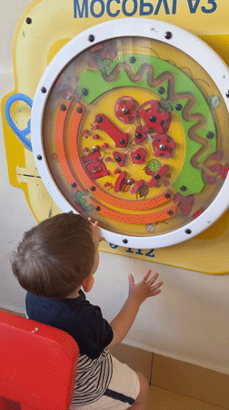 Child plays with interactive toys in Odintsovo playroom