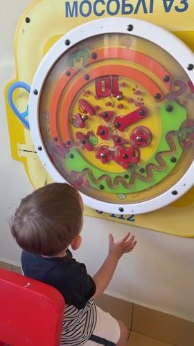 Child plays with interactive toys in Odintsovo playroom