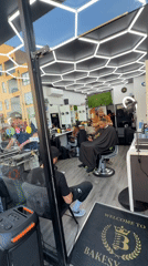 DJ performs live music inside London barbershop, draws crowd