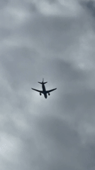 Low-angle views of a plane climbing over Saint Petersburg skies