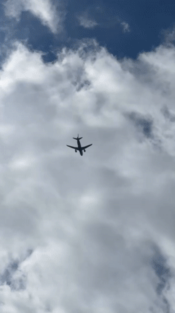 Low-angle views of a plane climbing over Saint Petersburg skies