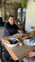 Man enjoys seafood lunch at Sochi restaurant