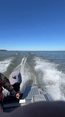 Speeding across open water near Beregovoe, Russia