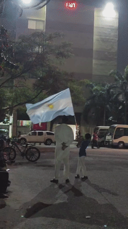 Argentine flag celebration in the streets of Dhaka at night