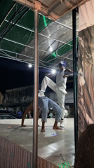 Acrobatics and fire breathing light up an outdoor Ado stage