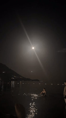 Full moon night along the Budva Riviera beach strip