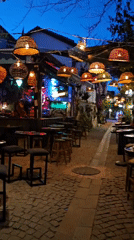 Evening street scenes documented across historic Seferihisar, Turkey