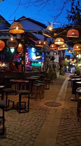Evening street scenes documented across historic Seferihisar, Turkey