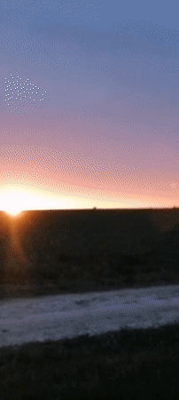 Sunset captured over open landscape with dramatic sky colors