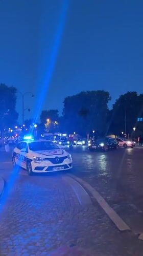Moroccan flag-waving celebration spills onto Paris streets at dusk