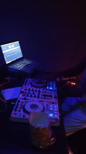 DJ performs at intimate bar venue in Lokoja, Nigeria