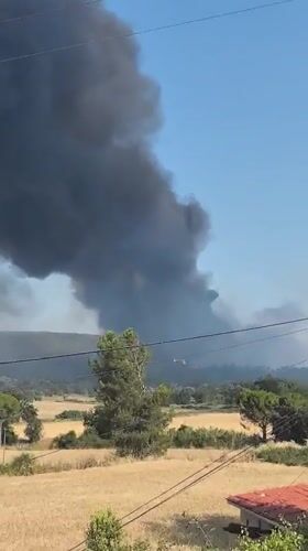 Heavy black smoke rises over rural Sallent, Spain