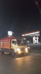 Late-night traffic jam backs up Karangsatria intersection in wet conditions