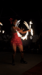 Fire dancers and musicians perform nighttime show in Denpasar