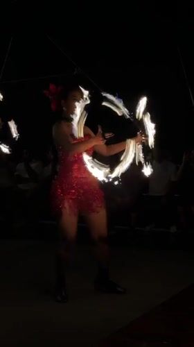 Fire dancers and musicians perform nighttime show in Denpasar