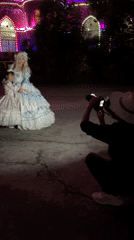 Period costume photo session at illuminated castle building