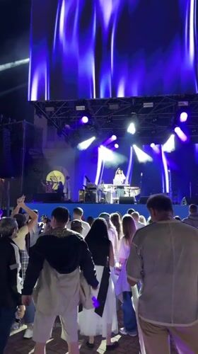 Rainy outdoor concert night in Estosadok, Russia