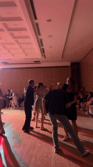 Salsa dancing event draws couples to ballroom venue