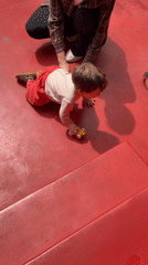 Child plays with toy car in Yerevan morning scene
