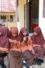 Indonesian schoolchildren documented during regular classroom and schoolyard activities