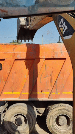 Shymkent waste clearance site: heavy machinery, dump trucks, and debris