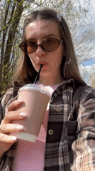 Woman documents cafe visit in Klin, Russia morning outing