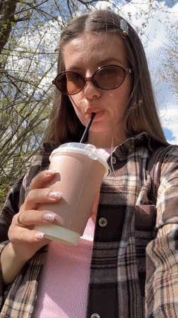 Woman documents cafe visit in Klin, Russia morning outing
