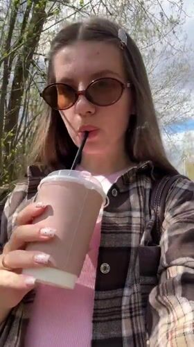 Woman documents cafe visit in Klin, Russia morning outing